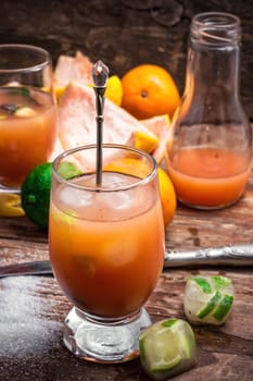 glass with drink of freshly squeezed tropical fruit with pulp.Selective focus.Photo tinted.