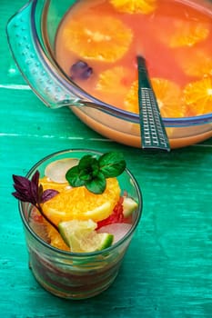 glass with drink of freshly squeezed tropical fruit with pulp.Selective focus.Photo tinted.