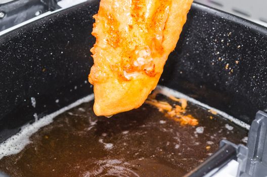 Fresh coley fillet done in beer batter for the fryer.