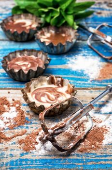 process of making coffee muffins on wooden countertop in rustic style.Photo tinted.Selective focus