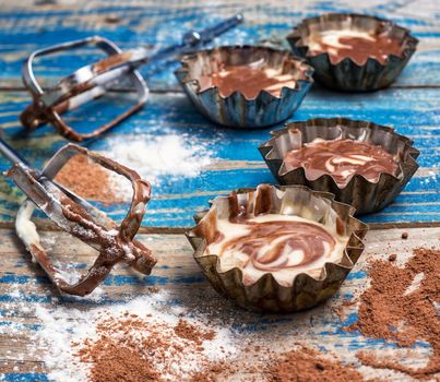 process of making coffee muffins on wooden countertop in rustic style.Photo tinted.Selective focus