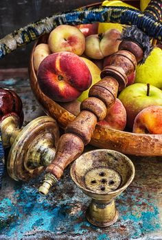 Details were worked hookah on the table amid fresh peaches.Photo tinted.