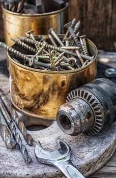 Set of old tools of the keys,screws and drills.Selective focus