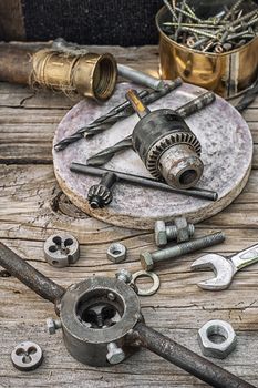 Set of old tools of the keys,screws and drills.