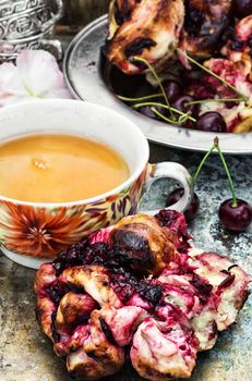 fresh Cup of aromatic tea to cherry pie.Photo tinted.Selective focus