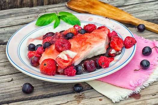 curd jelly cake with strawberries,raspberries and black currants.