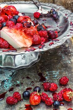 curd jelly cake with strawberries,raspberries and black currants.Selective focus