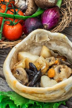 vegetable hot plate made of baked dough cooked in  rustic style.Photo tinted