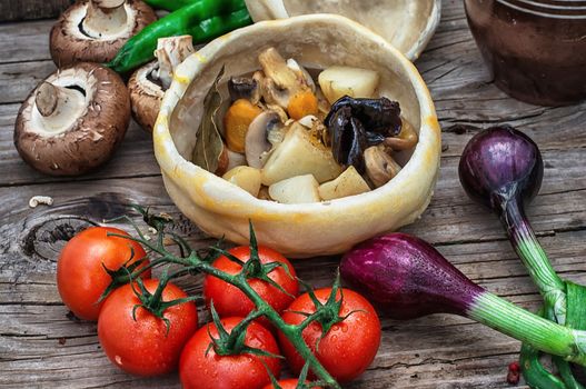 vegetable hot plate made of baked dough cooked in  rustic style.Photo tinted