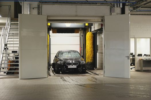 Gate of car washing in station washing tunnel