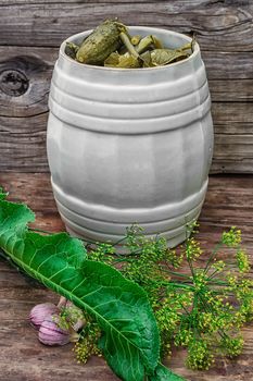 Pickles in barrel of pickles in rustic style.Photo tinted.