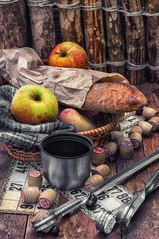Accessories picnic consisting of peaches,apples and lotto games.Photo tinted.