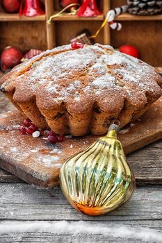 Baked homemade dessert for Christmas in the background decorations.Photo tinted.Selective focus