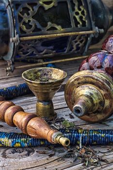 Details were worked hookah on the table .Photo tinted.Selective focus