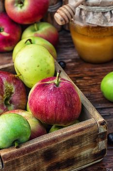 wooden box with the harvest of apples and honey for the holiday apple spas.Photo tinted.