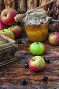 Still life from the harvest of ripe apples and honey to the Church celebration of the apple feast day.Photo tinted.