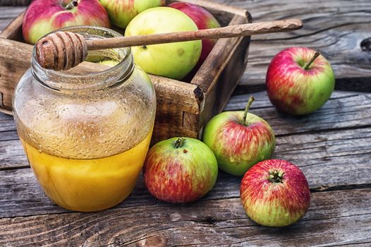 Still life from the harvest of ripe apples and honey to the Church celebration of the apple feast day.Photo tinted.