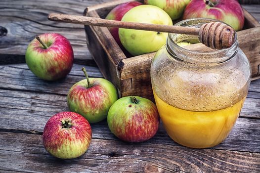 Still life from the harvest of ripe apples and honey to the Church celebration of the apple feast day.Photo tinted.Selective focus