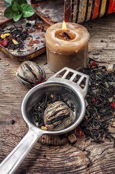 dry tea brew spilled on wooden background.Photo tinted