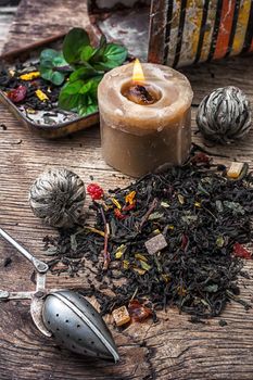 dry tea brew spilled on wooden background.Photo tinted.Selective focus