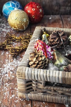 Christmas ornaments in wooden wicker box.Photo tinted.Selective focus