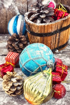 wooden tub with pine cones and Christmas decorations and ornaments.Selective focus