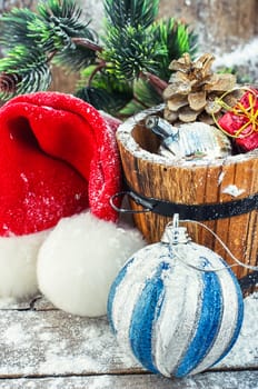 wooden tub with pine cones and Christmas decorations and ornaments.Selective focus