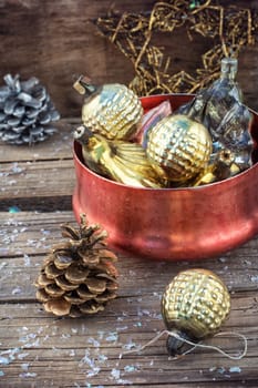 Festive Christmas decorations on wooden background in vintage style.Photo tinted.