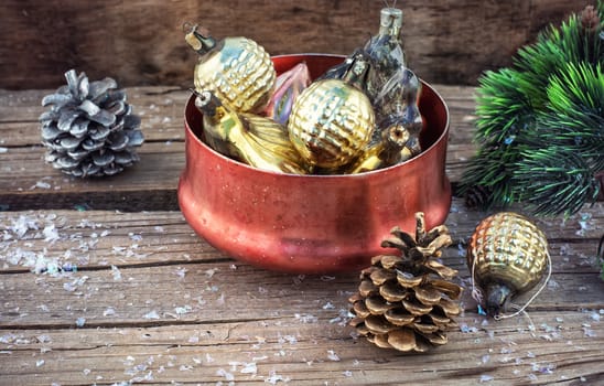 Festive Christmas decorations on wooden background in vintage style.Photo tinted.