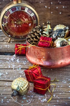 Festive Christmas decorations on wooden background in vintage style.Photo tinted.Selective focus