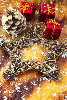 Festive Christmas decorations on wooden background in vintage style.Photo tinted.Selective focus