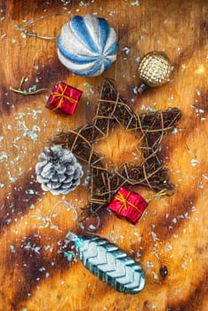 Festive Christmas decorations on wooden background in vintage style.Photo tinted.