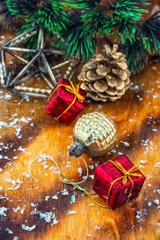 Festive Christmas decorations on wooden background in vintage style.Photo tinted.
