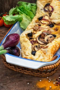 baked in the oven meat shawarma with vegetables in a rustic style.The image is tinted