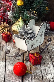 Christmas decorations on the background of the sleigh of Santa Claus .Photo tinted.