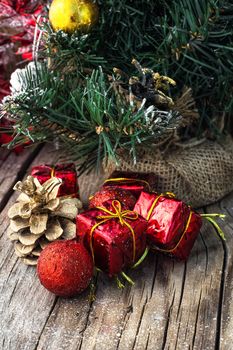 Christmas decorations with toys and cones on wooden plane.Photo tinted.