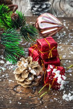 Christmas decorations with toys and cones on wooden plane.Photo tinted.