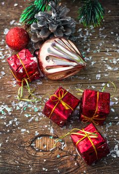 Christmas decorations with toys and cones on wooden plane.Photo tinted.