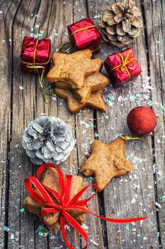 Christmas decorations and gingerbread cookies on wooden table .Photo tinted.