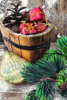 wooden tub with pine cones and Christmas decorations and ornaments.Selective focus