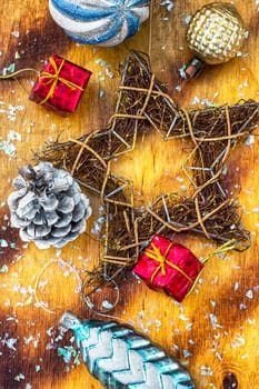 Festive Christmas decorations on wooden background in vintage style.Photo tinted.
