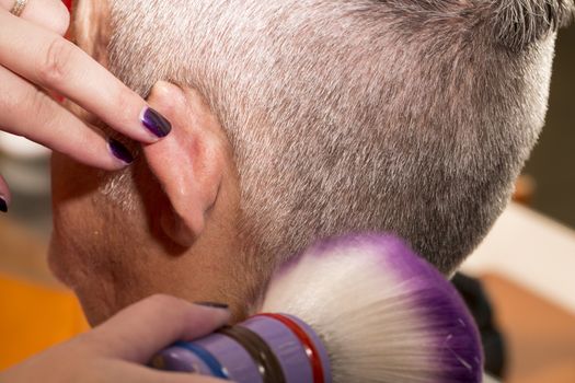 woman cuts hair with scissors, razor in  professional hairdressing salon