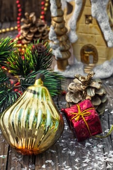 Christmas decorations from pine cones,toys on wooden background.Photo tinted
