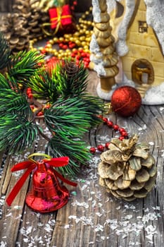 Christmas decorations from pine cones,toys on wooden background.Photo tinted
