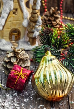 Christmas decorations from pine cones,toys on wooden background.Photo tinted
