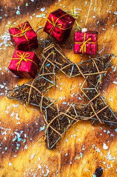 Traditional Christmas decorations of balls and cones on wooden table in vintage style.