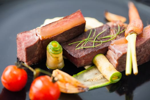 Dry-aged beef steak with mesh potato and vegetable, a modern style food