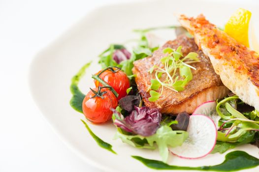 Modern style clean food, grilled salmon with toast and salad dressed with green sauce
