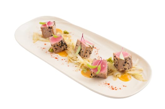 Modern style Japanese food, Burned tuna with herbs isolated on white background with clipping path