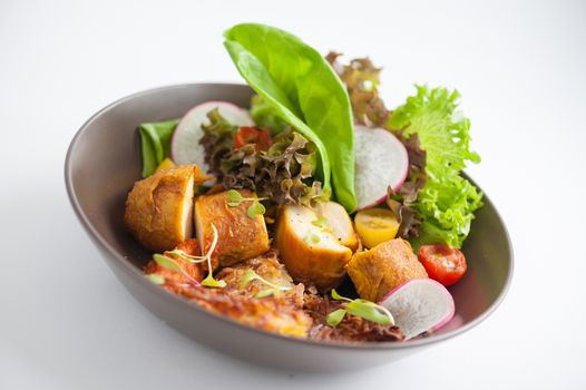 Chicken breast wrapped with vegetables and hash brown in clean food concept